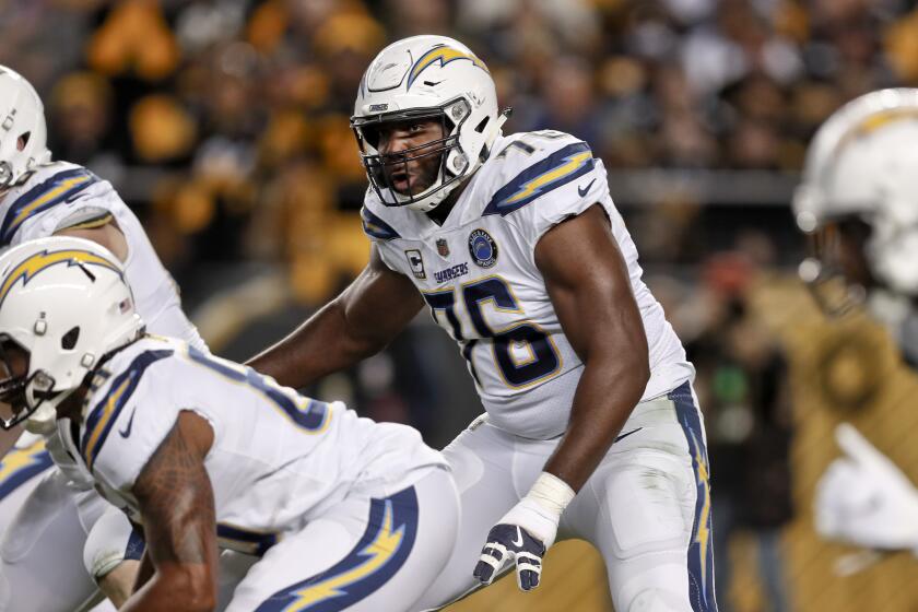 FILE - In this Dec. 2, 2018, file photo, Los Angeles Chargers offensive tackle Russell Okung (76) plays against the Pittsburgh Steelers in an NFL football game in Pittsburgh. Okung took part in his first practice since June 1, 2019, when he suffered a pulmonary embolism during an offseason workout at the team facility. He is being treated for blood clots and has been on the non-football injury list. (AP Photo/Don Wright, File)