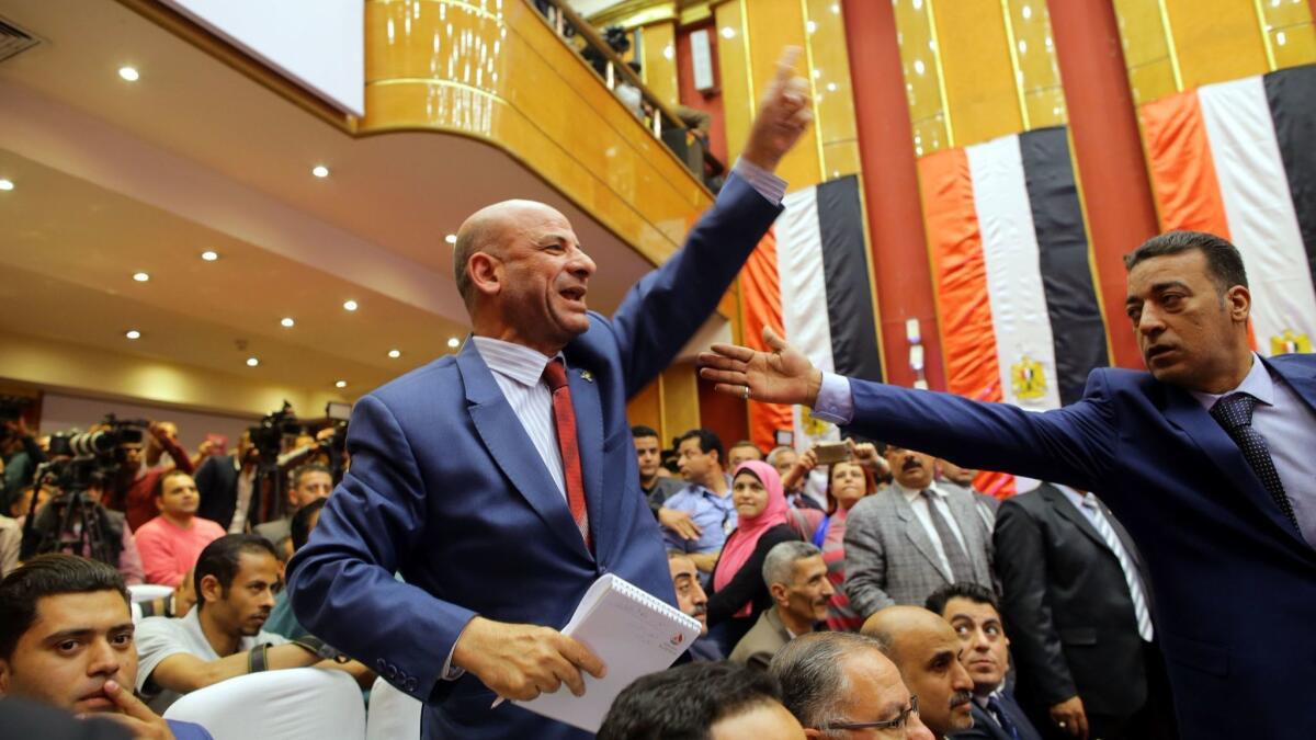 A man reacts during a National Election Commission news conference in Cairo on Monday at which the final results of Egypt's presidential election were announced.