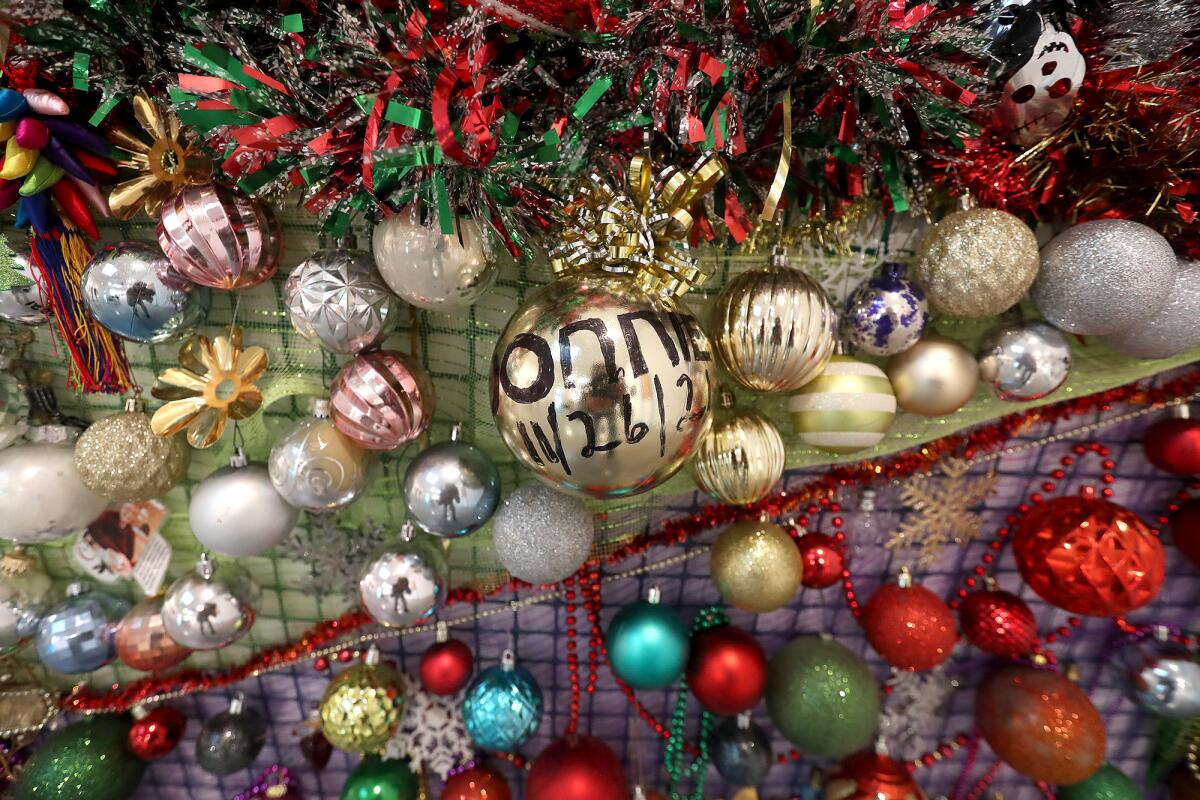 Discarded Christmas ornaments make up the Spirit Mountain outline on display at "Spirit of the Land."