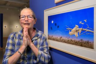 June 28, 2018, Carlsbad, California_USA_| Portrait of artist Janell Cannon at Carlsbad Library's gallery with "Stellaluna" she created in 1992 that's the cover of her best selling children's book of the same name. |_Photo Credit: Photo by Charlie Neuman
