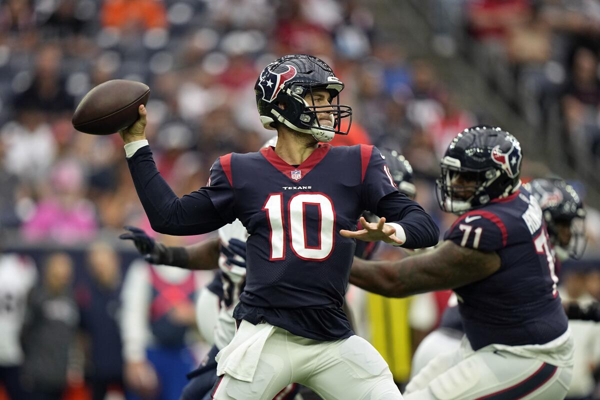 Houston Texans quarterback Davis Mills throws a pass against the New England Patriots during the first half of an NFL football game Sunday, Oct. 10, 2021, in Houston. (AP Photo/Eric Christian Smith)