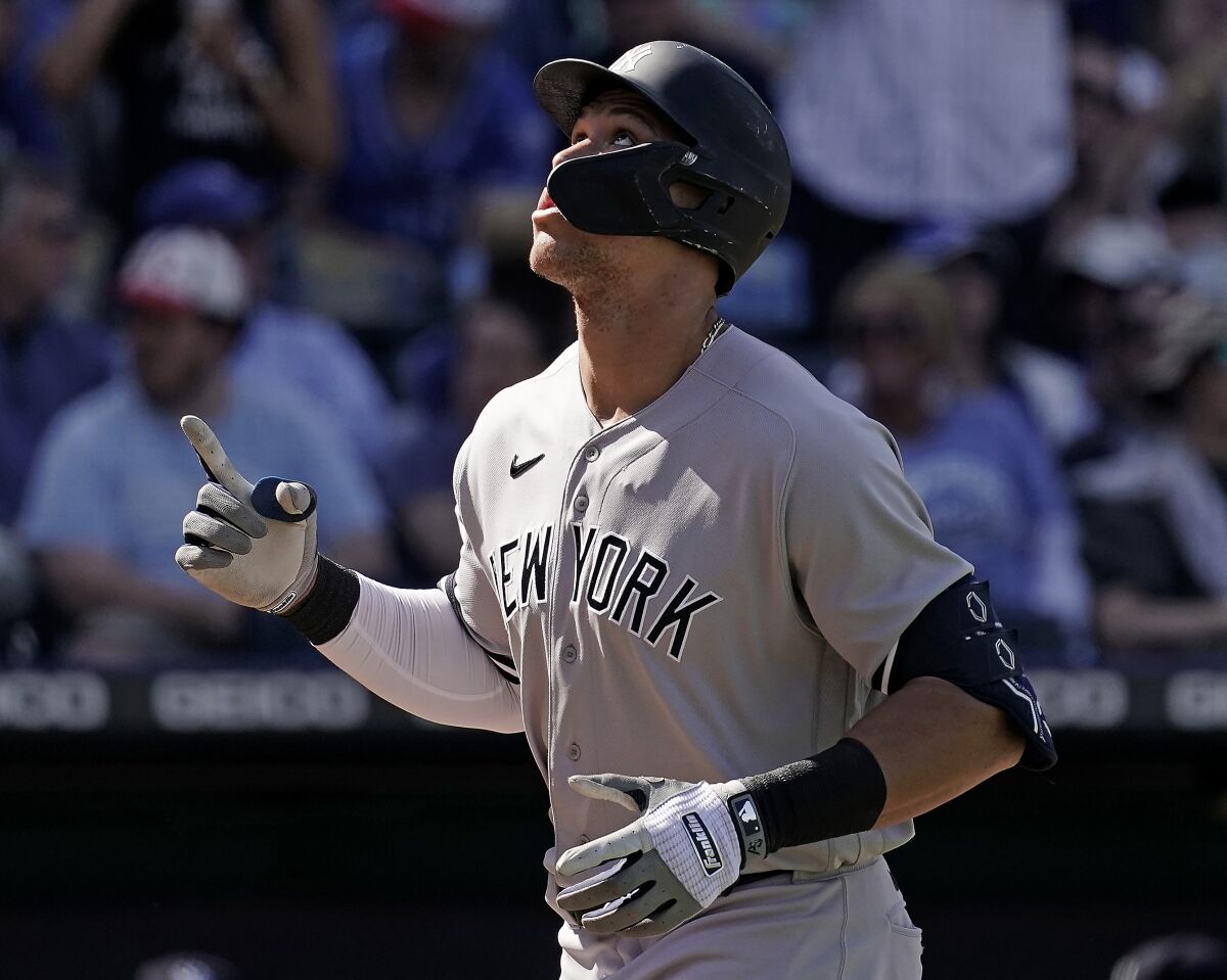 New York Yankees' Aaron Judge celebrates as he crosses the plate after hitting a solo home run during the ninth inning of a baseball game against the Kansas City Royals Sunday, May 1, 2022, in Kansas City, Mo. The Yankees won 6-4. (AP Photo/Charlie Riedel)