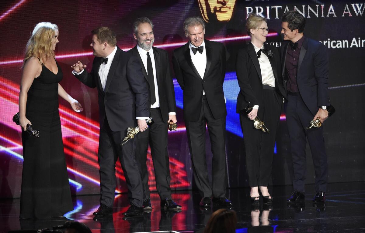 From left, honorees Amy Schumer, James Corden, Sam Mendes, Harrison Ford, Meryl Streep and Orlando Bloom, mingle onstage at the BAFTA Los Angeles Britannia Awards on Oct. 30, 2015.