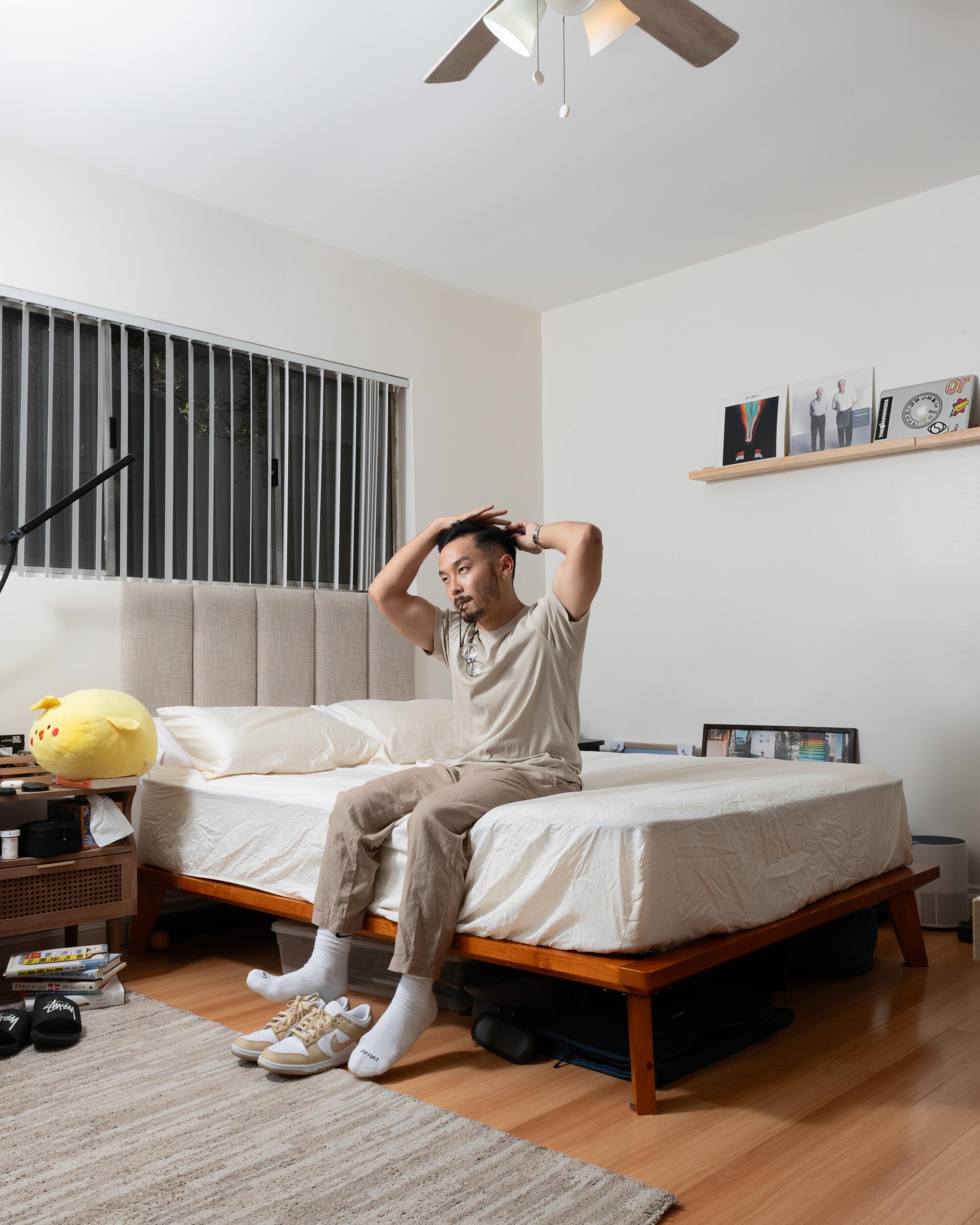 Ryan Kageyama poses for a portrait in his home in Palms, Los Angeles.