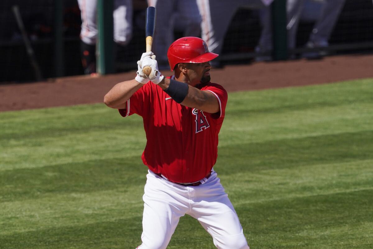 Angels first baseman Albert Pujols bats against the San Francisco Giants on March 11.
