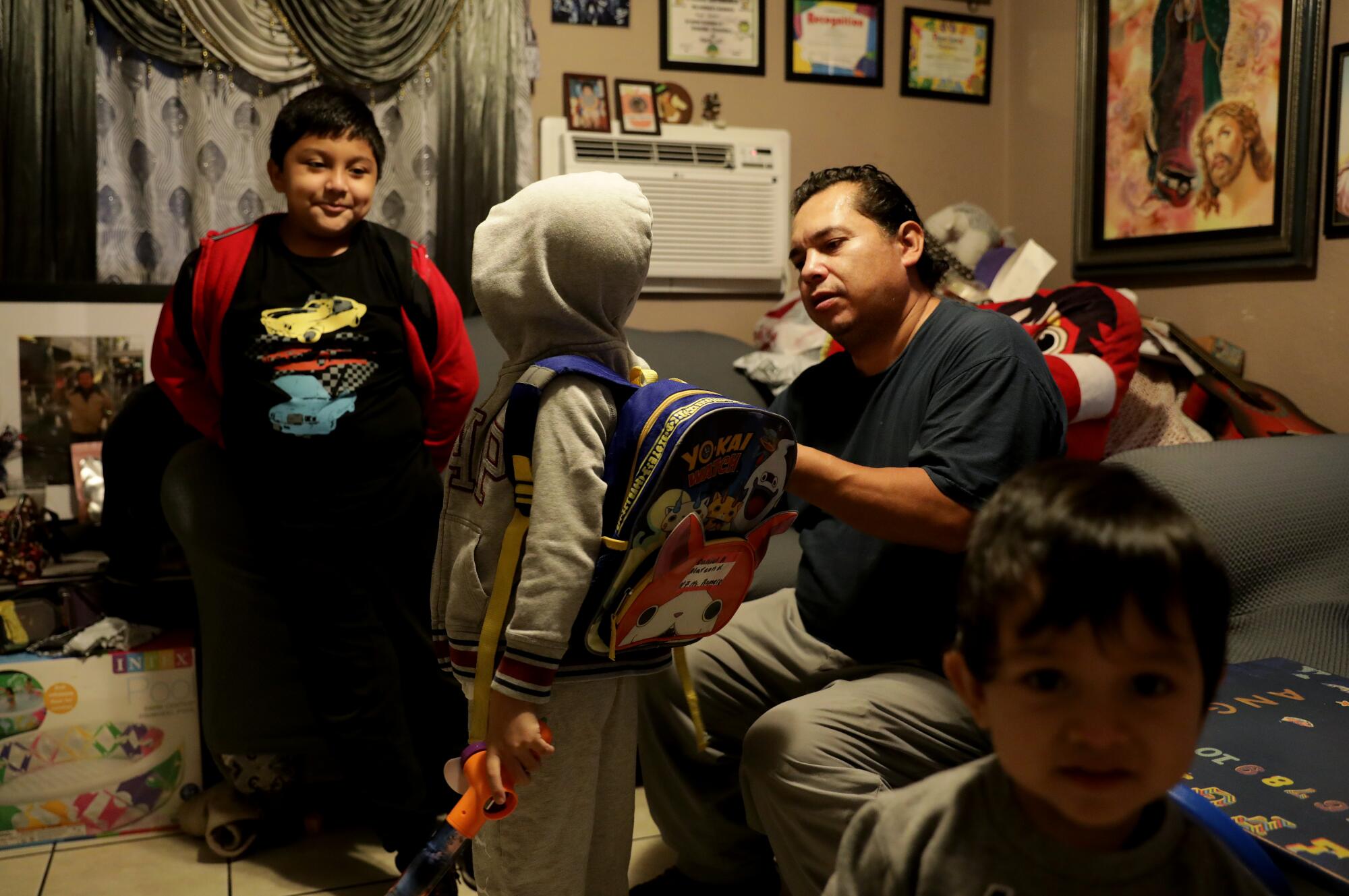 Mario Alarcon with children Angel, Daniel and Alfredo.