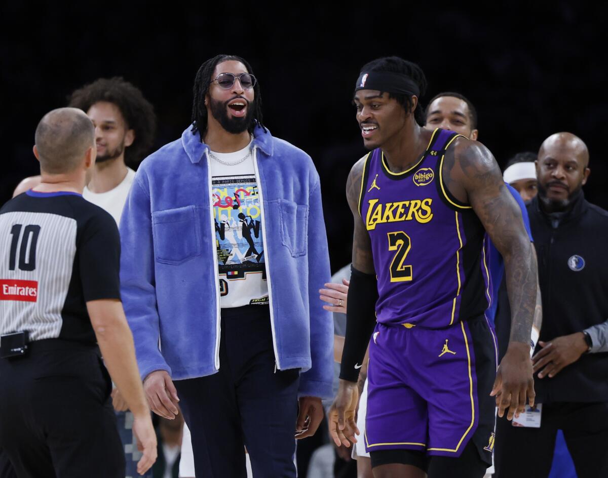 Former Laker Anthony Davis shares a moment with Jarred Vanderbilt in the second half.