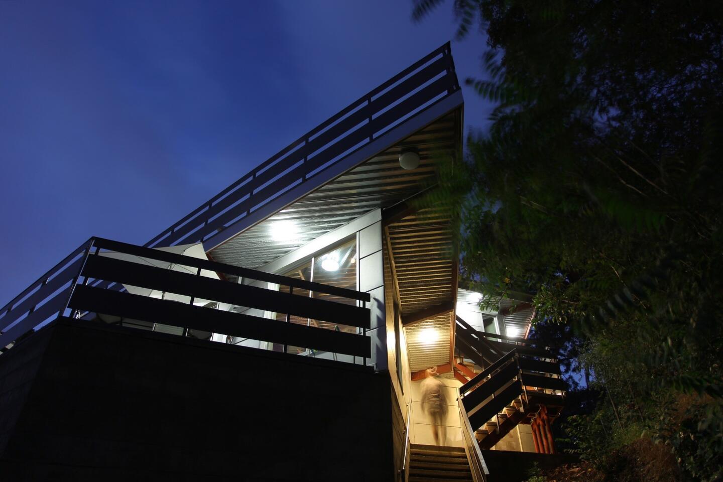 Stairs climb from the street toward the front door of the Tattuplex, Tim Tattu's Silver Lake house. The two-story house's unusual angles are built on a prefabricated steel system.
