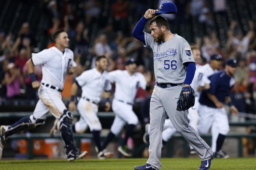 Kansas City Royals reliever Greg Holland walks off the field after giving up a game-winning RBI single to Detroit Tigers shortstop Dixon Machado during a game on Sept. 18.