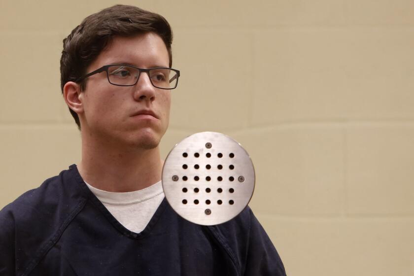 FILE - In this April 30, 2019 file photo John T. Earnest appears for his arraignment hearing in San Diego. The 19-year-old suspect in the fatal shooting at a Southern California synagogue is scheduled to make his first court appearance Tuesday, May 14, 2019, on federal hate crime charges. (Nelvin C. Cepeda/The San Diego Union-Tribune via AP, Pool, File)