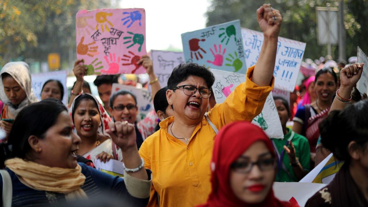 Women in New Delhi march on International Women's Day. Hundreds held street plays and marched on Thursday to highlight domestic violence, sexual attacks and discrimination in jobs and wages.