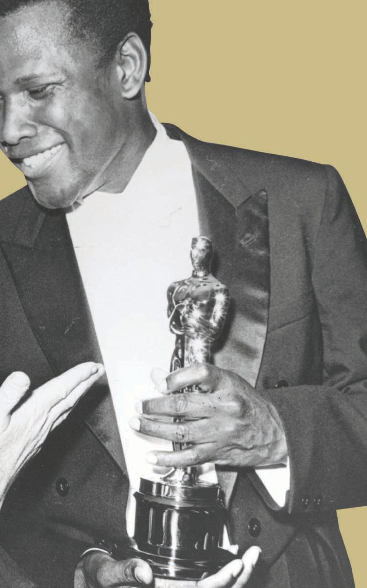 Sidney Poitier holding his Oscar