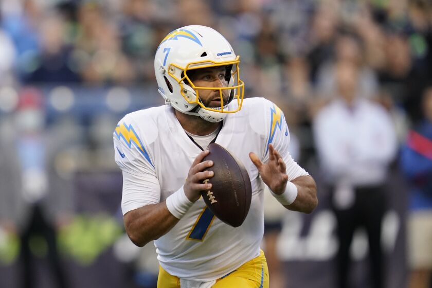 Los Angeles Chargers quarterback Chase Daniel (7) passes against the Seattle Seahawks during the first half of an NFL football preseason game, Saturday, Aug. 28, 2021, in Seattle. (AP Photo/Elaine Thompson)