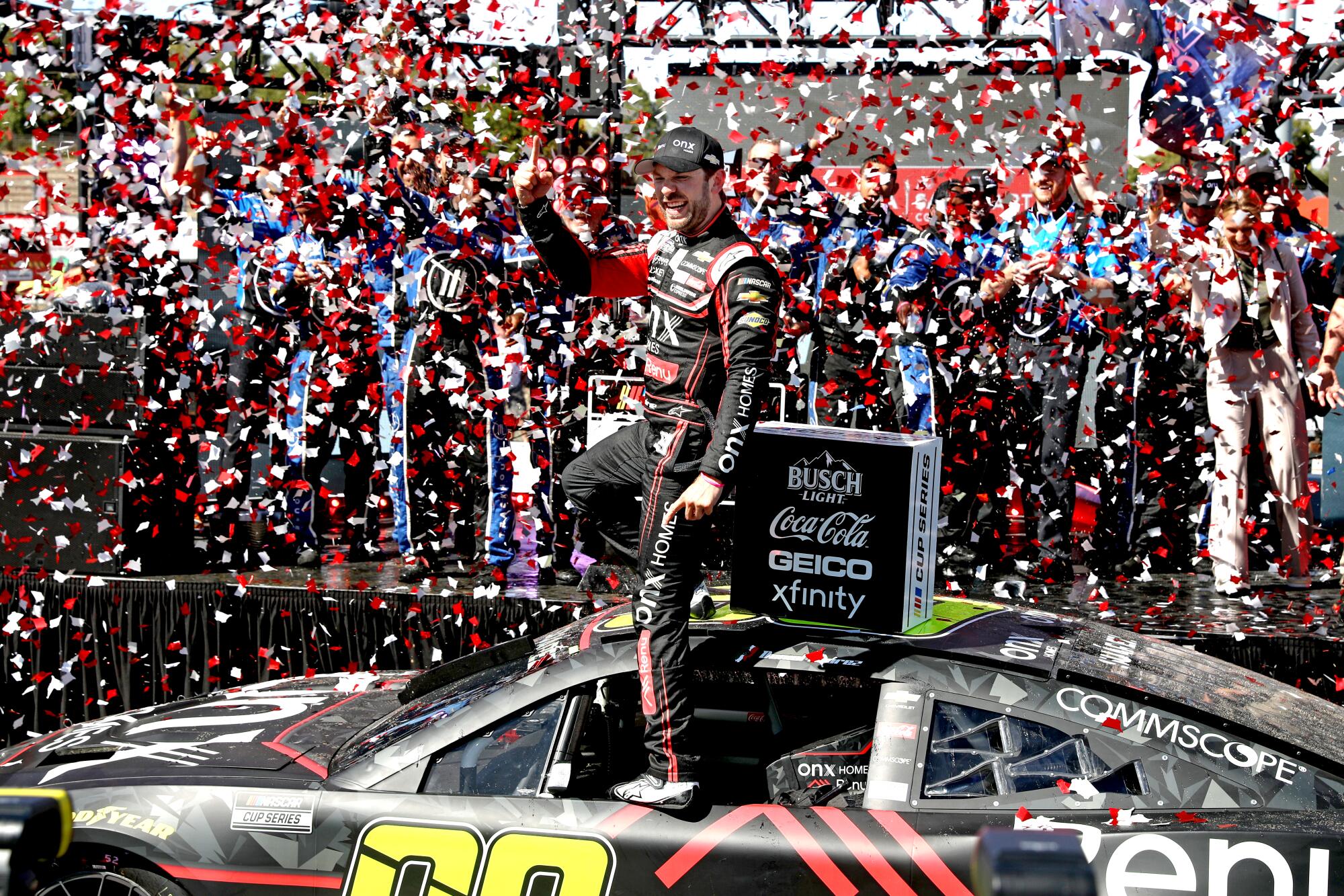Daniel Suárez celebrates after becoming the first Mexican-born driver to win a NASCAR Cup race with his victory.