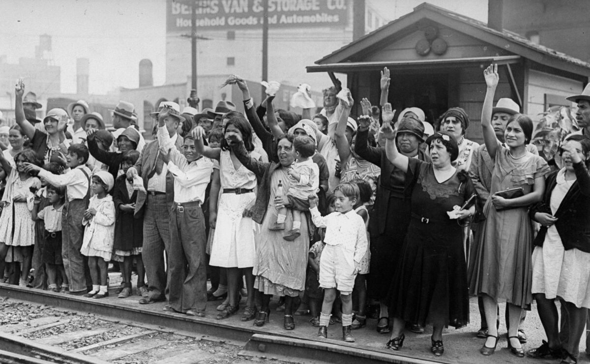 Relatives and friends wave goodbye to a train carrying 1,500 Mexicans expelled from L.A.