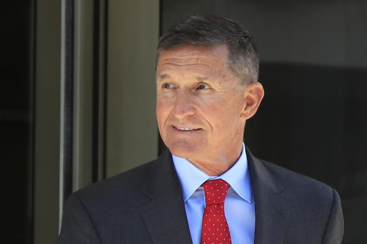 Former Trump national security adviser Michael Flynn leaves the federal courthouse in Washington, following a status hearing in 2018. 