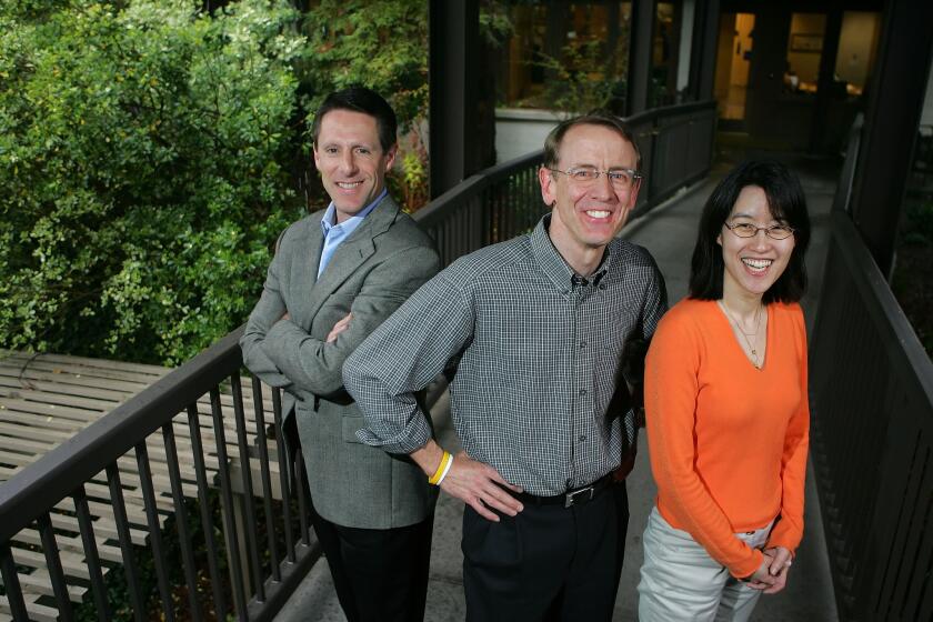 Venture capitalist John Doerr, middle, poses for a portrait with partners John Denniston, left, and Ellen Pao outside their office in Menlo Park on April 4, 2006.