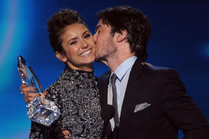 "The Vampire Diaries" actors Nina Dobrev and Ian Somerhalder accept their Favorite On Screen Chemistry award at The 40th Annual People's Choice Awards at Nokia Theatre L.A. Live in Los Angeles.