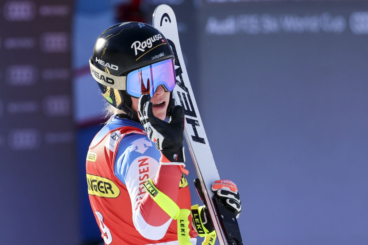 Switzerland's Lara Gut Behrami crosses the finish line during an alpine ski, women's World Cup downhill race, in Zauchensee, Austria, Saturday, Jan. 15, 2022. (AP Photo/Marco Trovati)