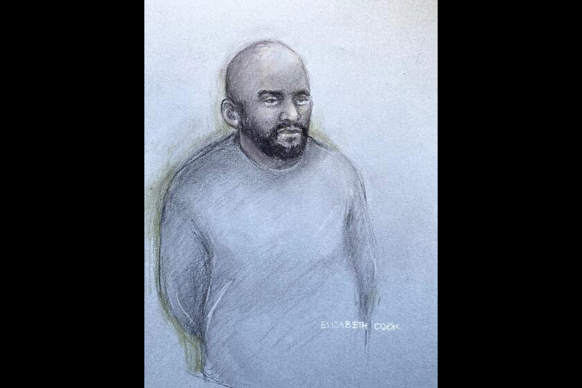 This court artist sketch by Elizabeth Cook shows Aine Leslie Davis, 38, appearing in the dock at Westminster Magistrates' Court, central London, Thursday, Aug. 11, 2022. An alleged member of an Islamic State hostage-taking cell nicknamed “The Beatles” has been charged with terrorism offenses in Britain on Thursday after being deported from Turkey. London police say Aine Davis was arrested at Luton Airport north of London on Wednesday night and charged with offenses under the Terrorism Act. (Elizabeth Cook/PA via AP)