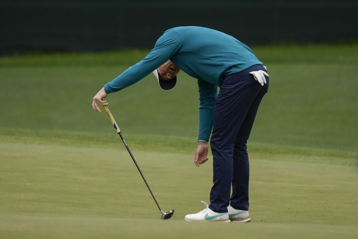 Rory McIlroy, of Northern Ireland, reacts after a missed putt on the fifth green during the third round at the Masters golf tournament on Saturday, April 9, 2022, in Augusta, Ga. (AP Photo/Jae C. Hong)