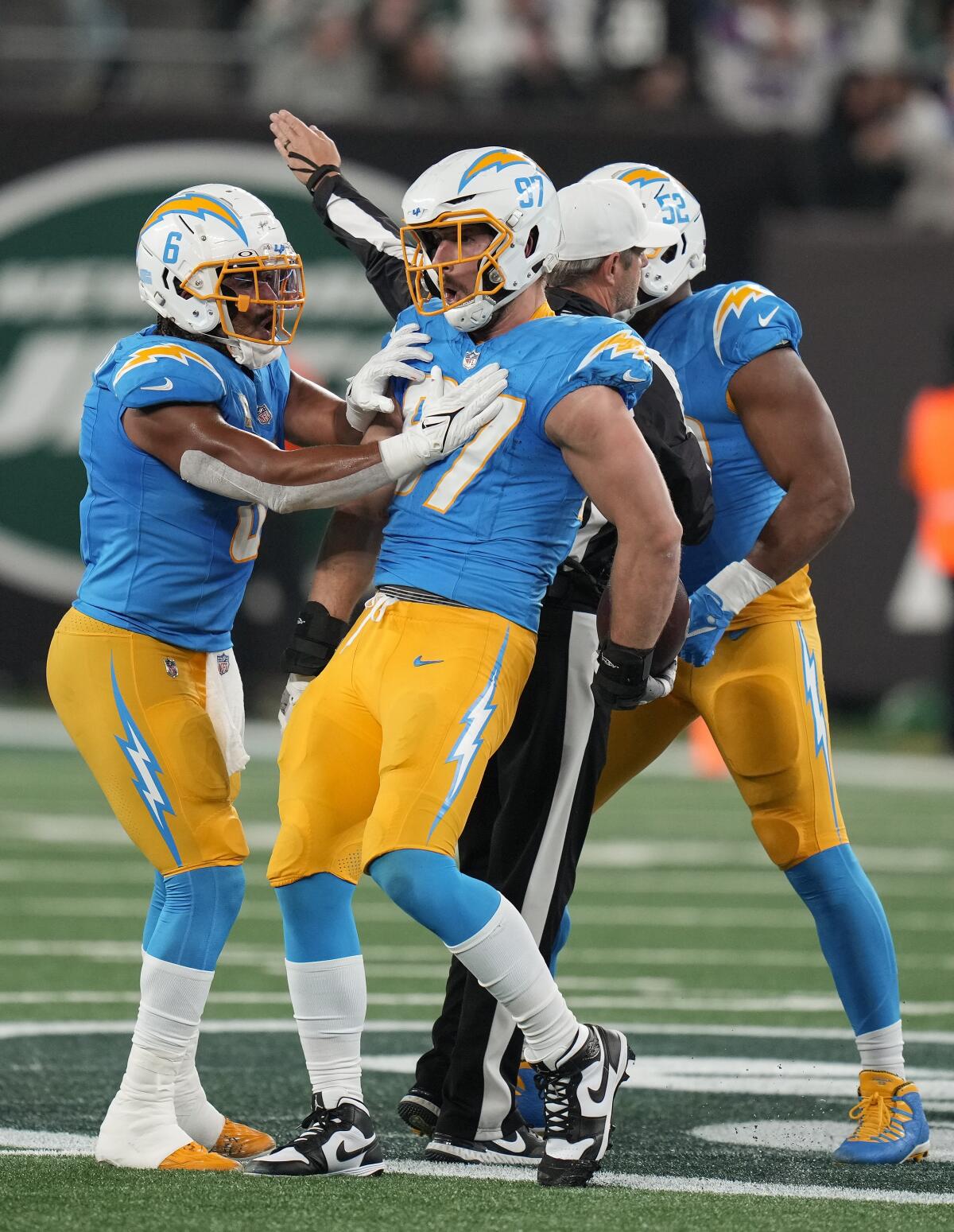 Chargers linebacker Joey Bosa (97) reacts after forcing and recovering a fumble by Jets quarterback Zach Wilson.