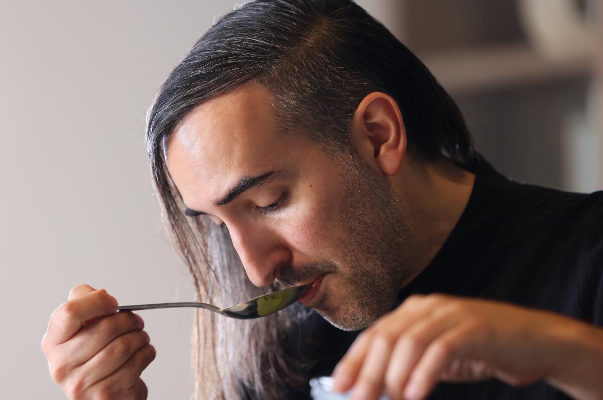 Chef Jordan Kahn sips something from a spoon