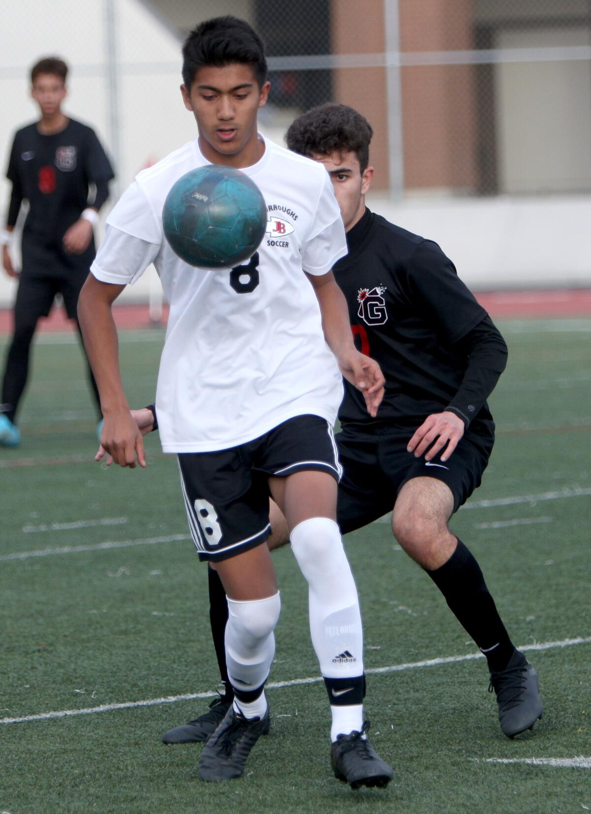 Burroughs High School soccer player Elias Galaviz controls the ball in game vs. Glendale High in Glendale on Tuesday, Jan. 21, 2020.