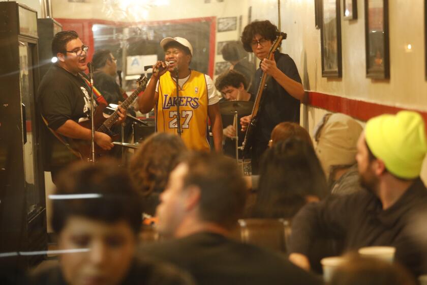 COMPTON, CA - JANUARY 28, 2020 - No Refunds, featuring Jacob Cohen, from left, Cedrick Turner, Zachery Shawwaf and Renan Carrasco, right, performs for patrons of Alexander's World Famous Tortas in Compton on January 28, 2020. The Compton restaurant specializes in tortas and burritos. They also host live rock shows one or two times a month featuring young local rock, goth and punk bands. (Genaro Molina / Los Angeles Times)