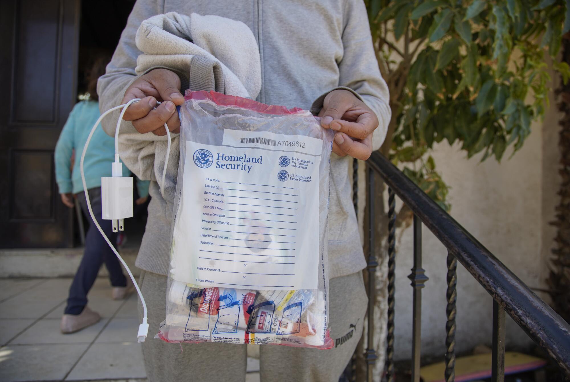 Asylum seekers arriving at the shelter come with a plastic bag for their belongings.