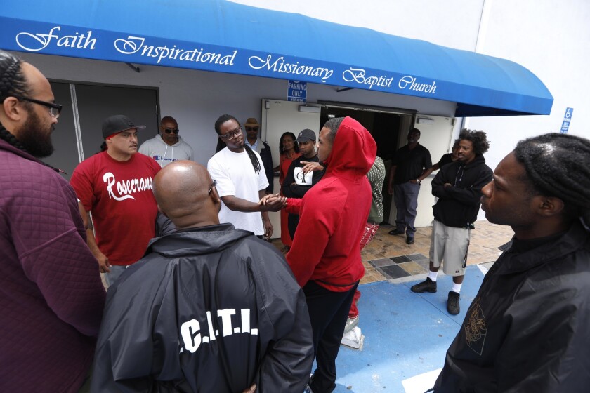 Gang leaders wish each other well after a cease-fire summit at the Faith Inspirational Missionary Baptist Church in Compton. The peace efforts were inspired by the sight of gang rivals coming together to pay tribute to slain rap star Nipsey Hussle.