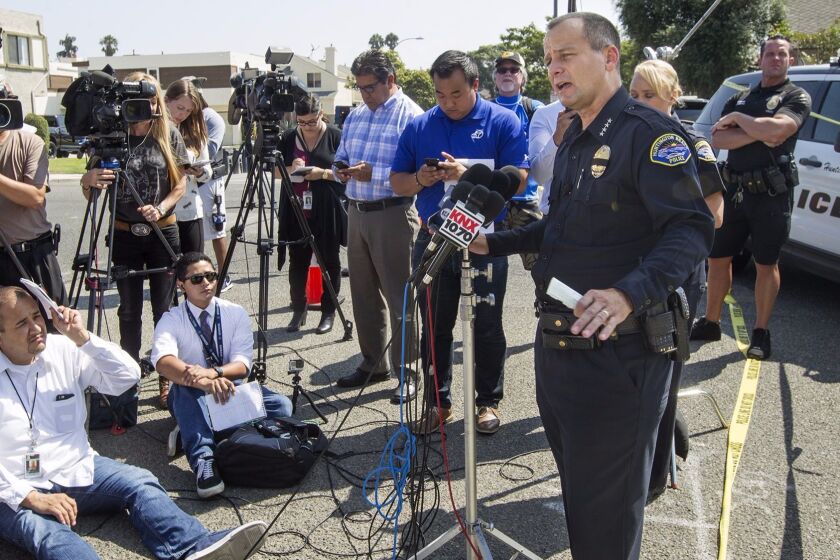 Huntington Beach Police Department Chief Robert Handy takes questions from members of the media regarding a shooting involving two police officers at a residence along Delaware St., near Utica Ave., during a press conference in Huntington Beach on Thursday. (Kevin Chang/ Staff Photographer)
