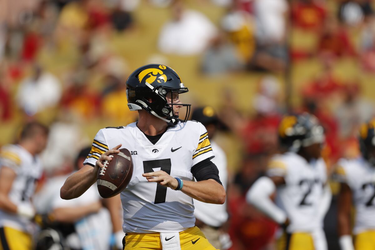 Iowa quarterback Spencer Petras (7) warms up before an NCAA college football game against Iowa State, Saturday, Sept. 11, 2021, in Ames, Iowa. (AP Photo/Matthew Putney)