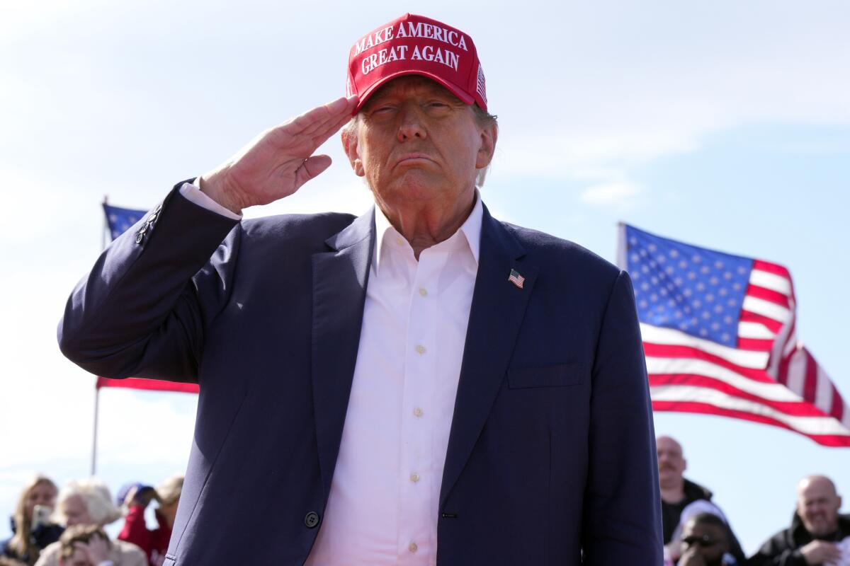 Donald Trump salutes at a campaign rally in Vandalia, Ohio.