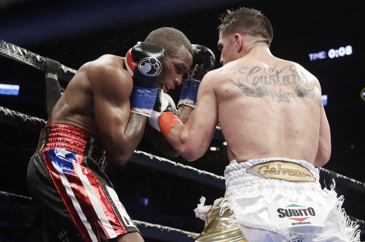 Argentina's Brian Carlos Castano , right, punches Cuba's Erislandy Lara during the eighth round of a WBA super welterweight championship boxing match Saturday, March 2, 2019, in New York.(AP Photo/Frank Franklin II)