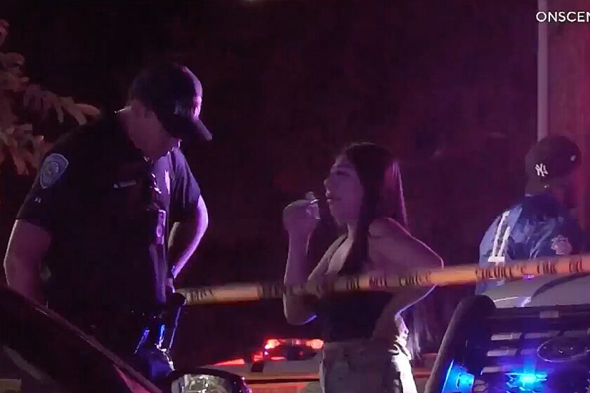 San Bernardino police officer investigates a shooting where nine people were shot, killing one, outside a party in San Bernardino County late Friday, May 20, 2022.