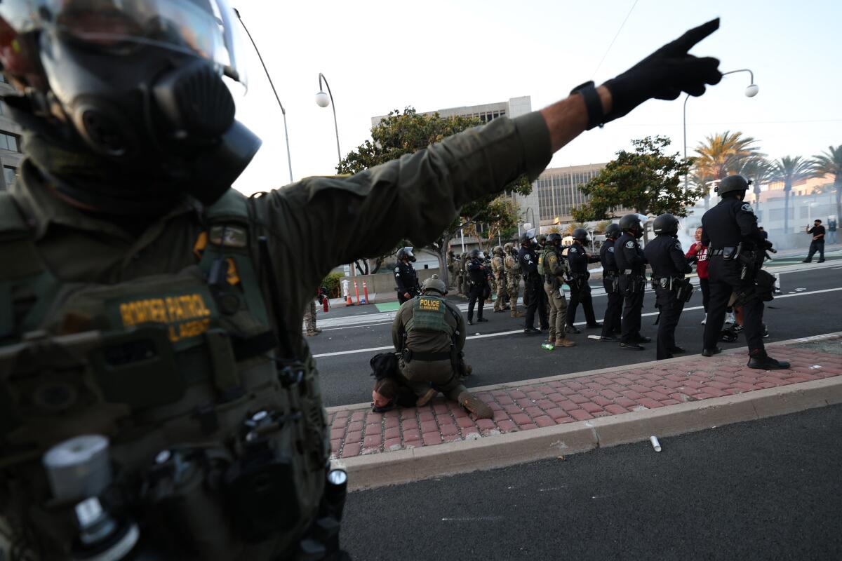A U.S. Border Patrol agent near the United States Citizenship and Immigration Services Santa Ana Field Office in June.