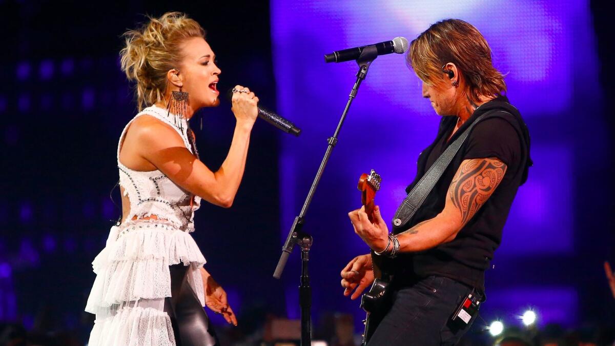 Carrie Underwood and Keith Urban perform during Wednesday's CMT Awards in Nashville.