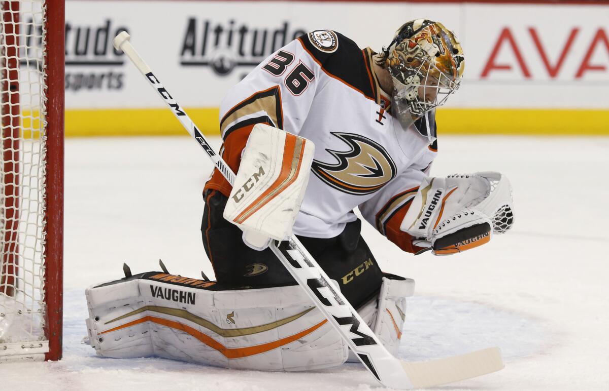 Ducks goalie John Gibson makes a glove-save on a shot against the Avalanche in the first period.