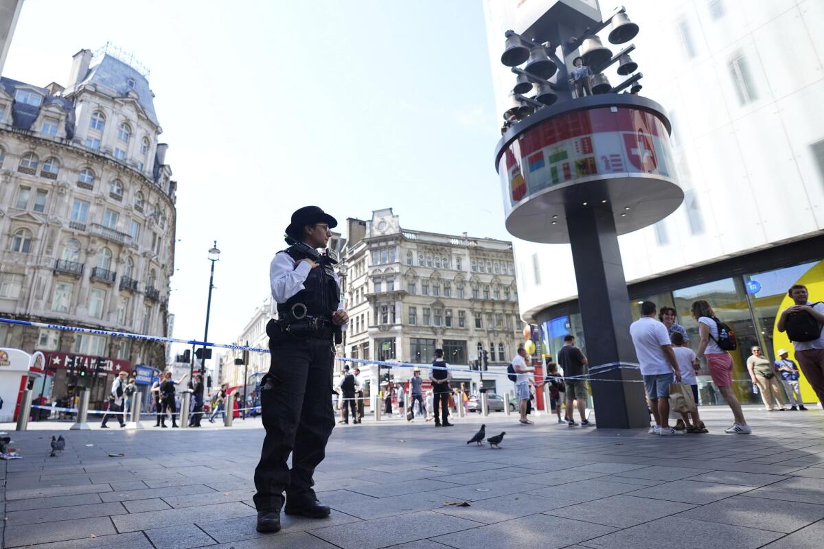 A Police officer stands in Leicester Square in London.