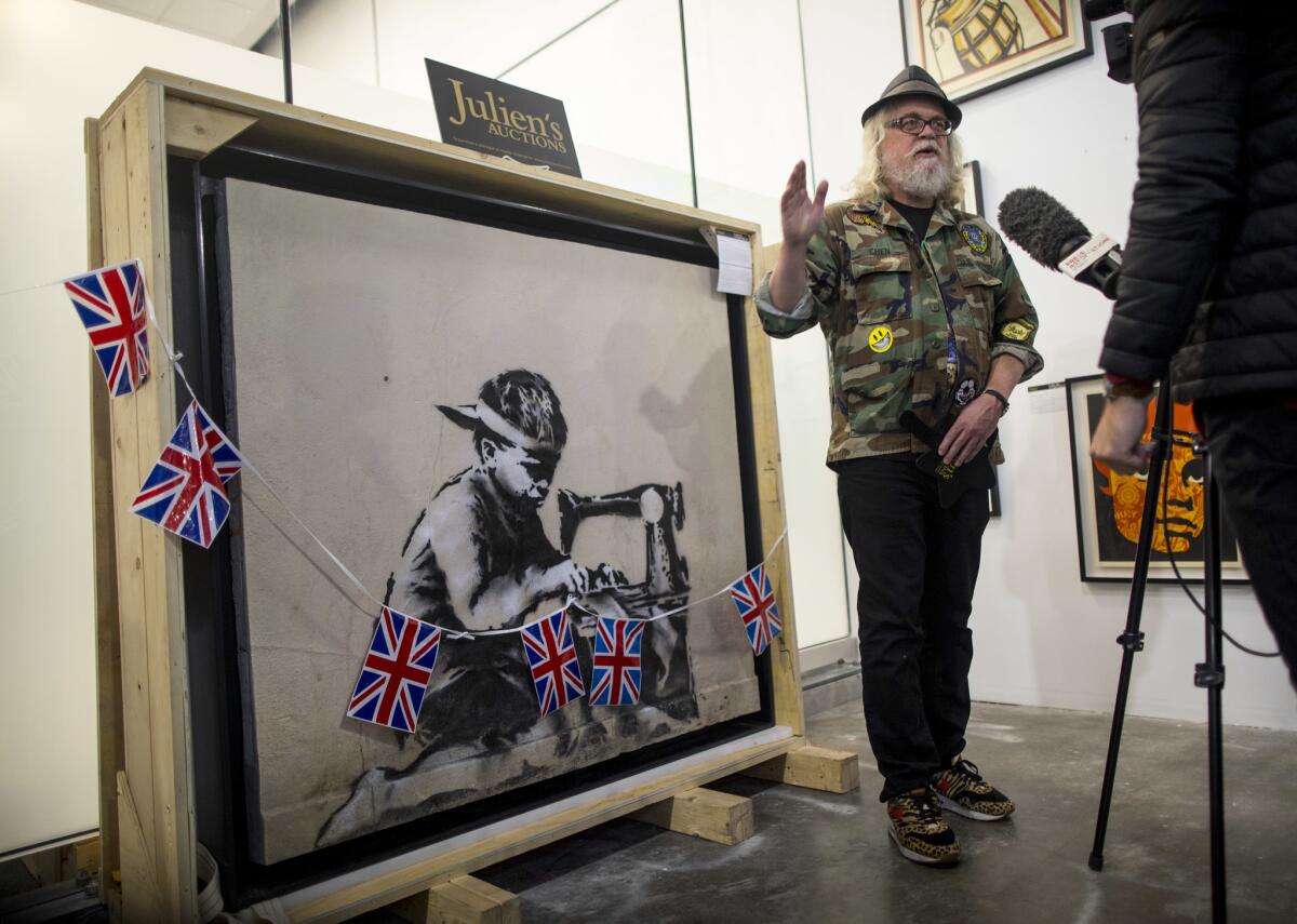 Ron English stands by "Slave Labour," the Banksy piece that English purchased at auction and then announced he wanted to whitewash.