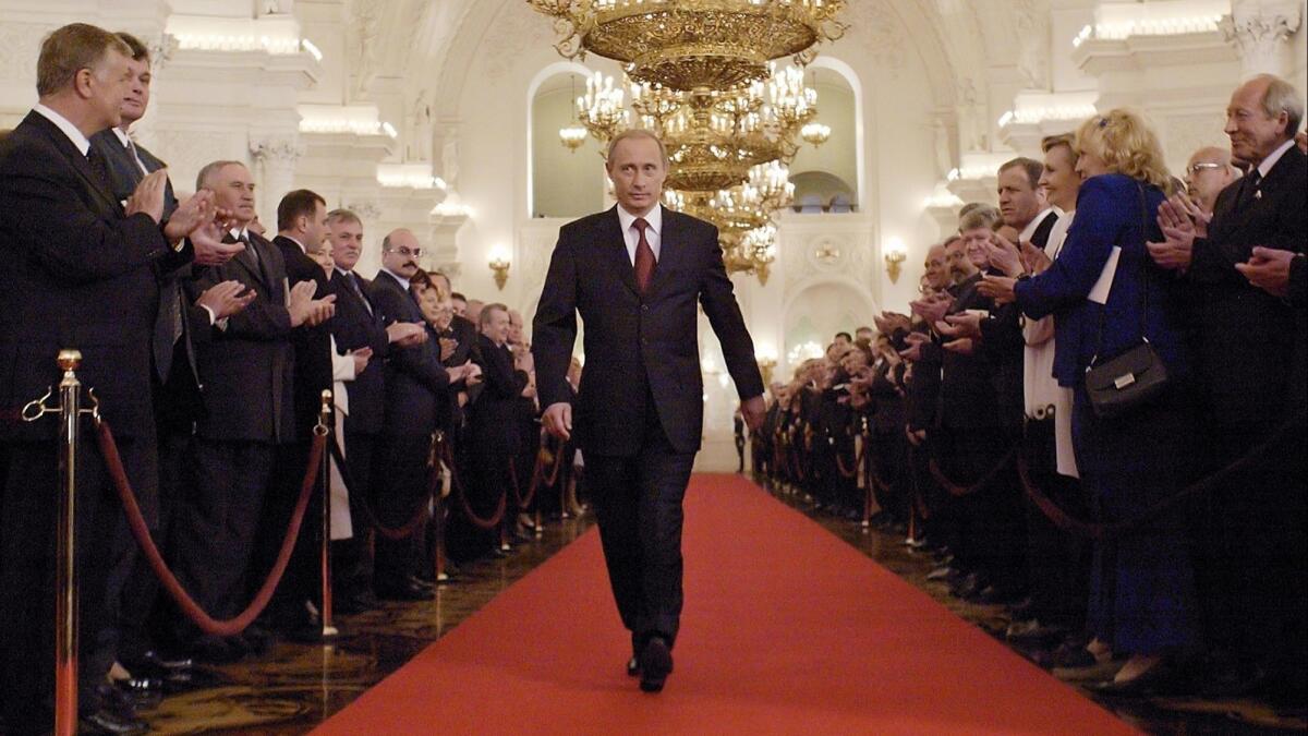 Russian President Vladimir Putin walks through St. George's Hall in the Kremlin to take part in his inauguration on May 7, 2004.