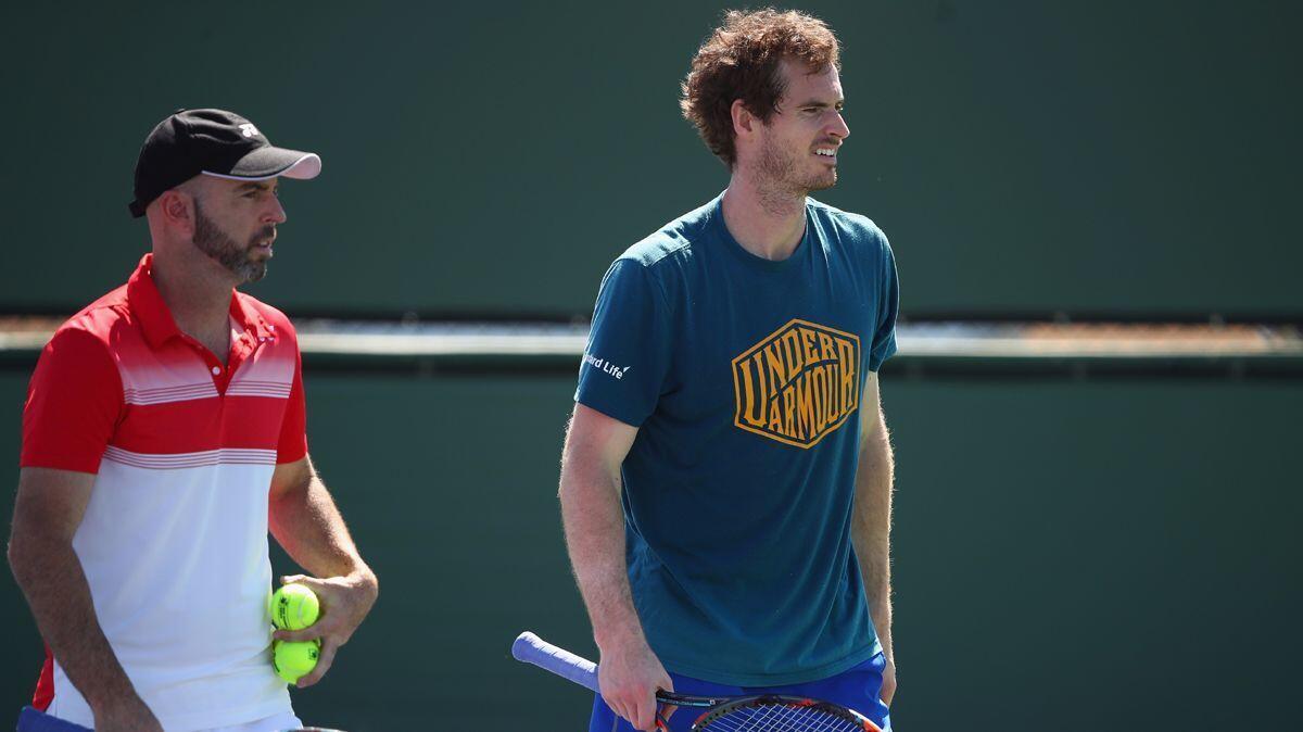 Andy Murray, right, works with Coach Jamie Delgado during his practice session Wednesday at the BNP Paribas Open at Indian Wells Tennis Garden.