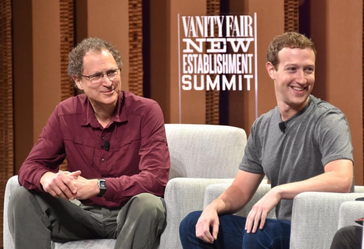 Oculus chief scientist Michael Abrash and Facebook CEO Mark Zuckerberg take part in the Vanity Fair New Establishment Summit at the Yerba Buena Center for the Arts in San Francisco on Oct. 7.