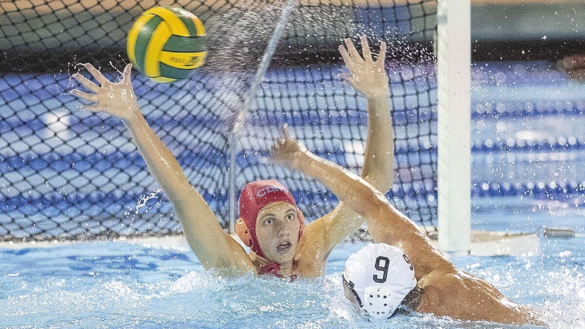 Corona del Mar High goalkeeper Harrison Smith attempts to block a shot by Foothill's Jakob Tallman during the semifinals of the CIF Southern Section Division 2 playoffs at Irvine's Woollett Aquatic Center on Wednesday.