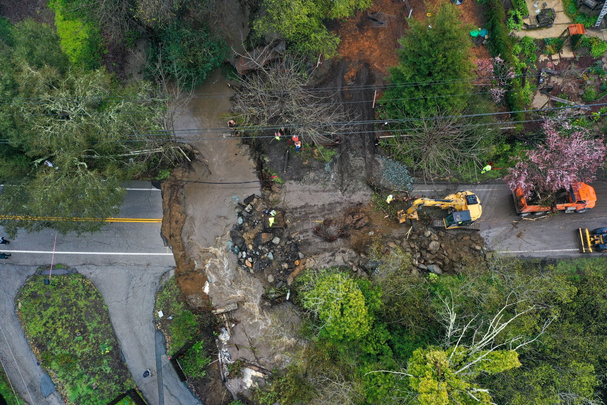 Aerial view of a road washed away by debris on North Main Street of Santa Cruz.