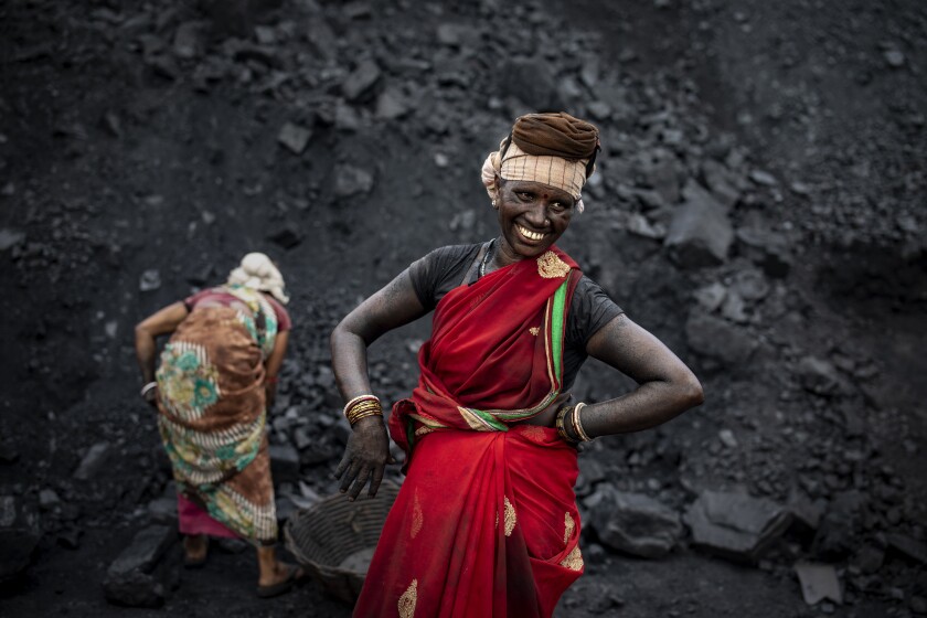 Smiling coal laborer in India
