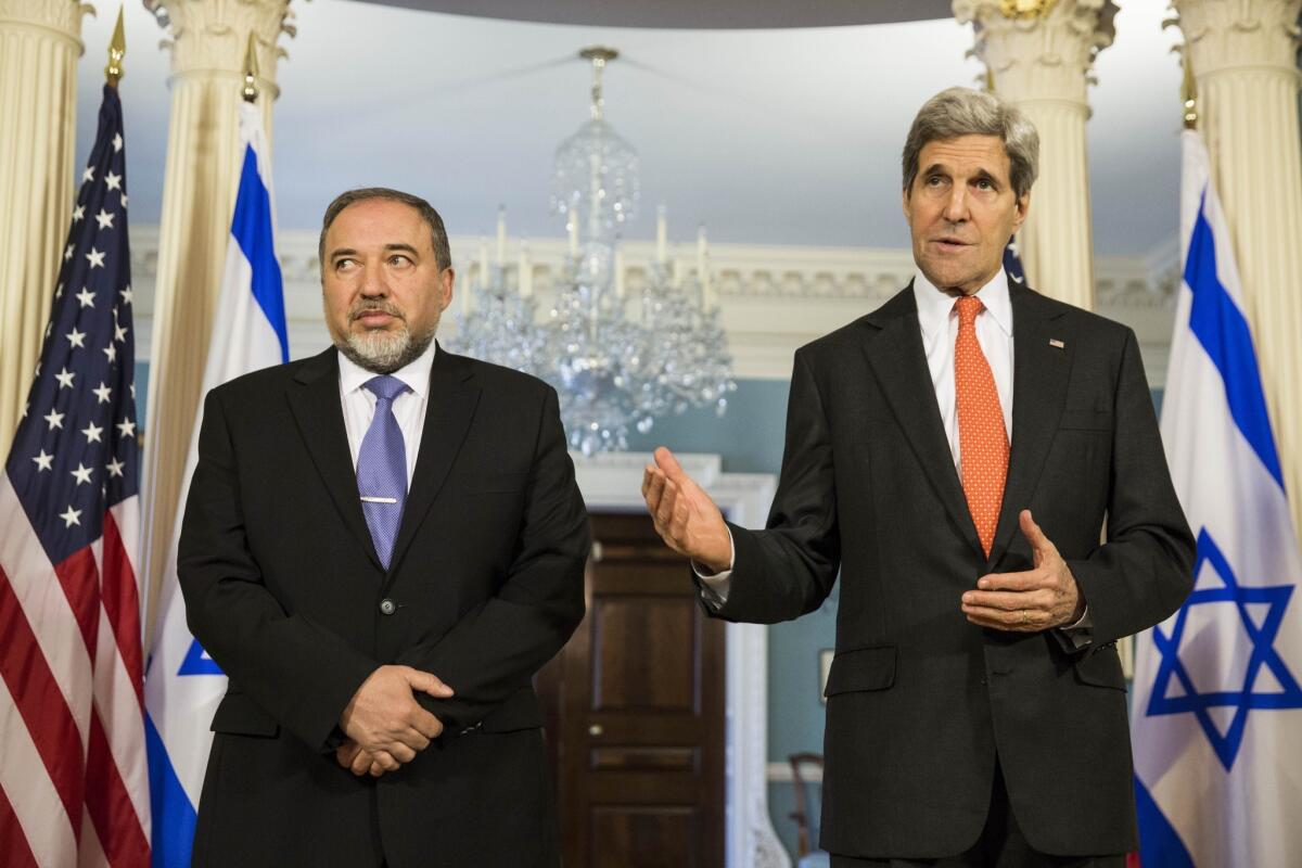Israeli Foreign Minister Avigdor Lieberman, left, and Secretary of State John Kerry speak to the media before meeting privately at the U.S. State Department.