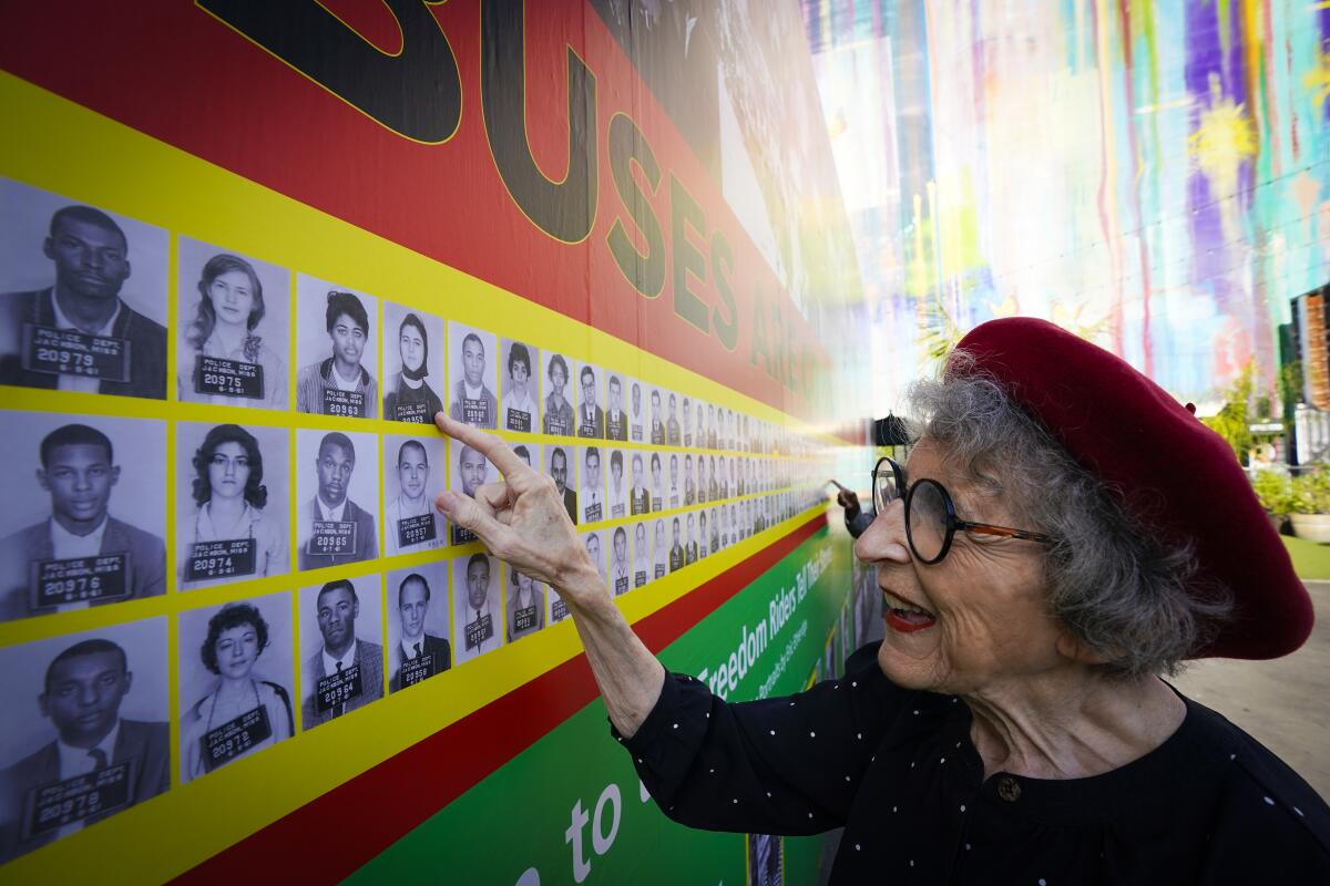 Freedom Rider Carol Ruth Silver looked at her arrest booking photo, which is part of a new exhibit in downtown San Diego.