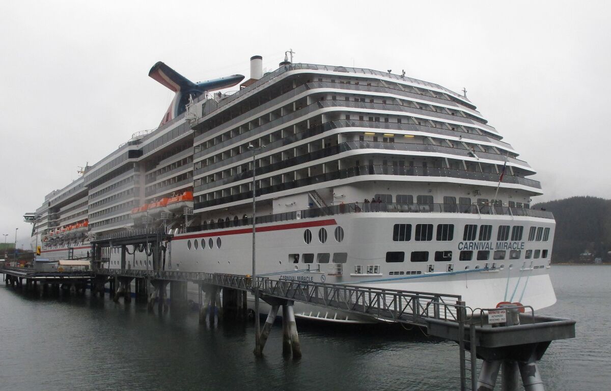 FILE - This May 2, 2013 file photo shows the Carnival Miracle docked in Juneau, Alaska. U.S. Coast Guard authorities have halted the search for a woman who reportedly went overboard on the cruise ship near Ensenada, Mexico. Petty Officer First Class Adam Stanton says authorities searched more than 31 hours for the woman before pausing the search on Sunday, Dec. 12, 2021, pending additional information. (AP Photo/Becky Bohrer, File)